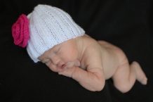 newborn baby girl wearing hat